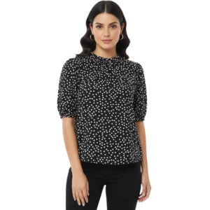 Woman in polka dot blouse